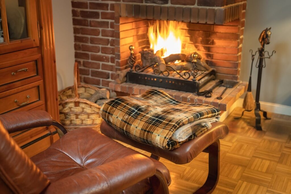 Chunky Winter Wool Blanket draped over a modern sofa