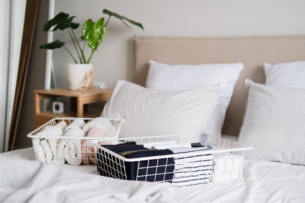 Mesh bedside caddy holding dorm essentials