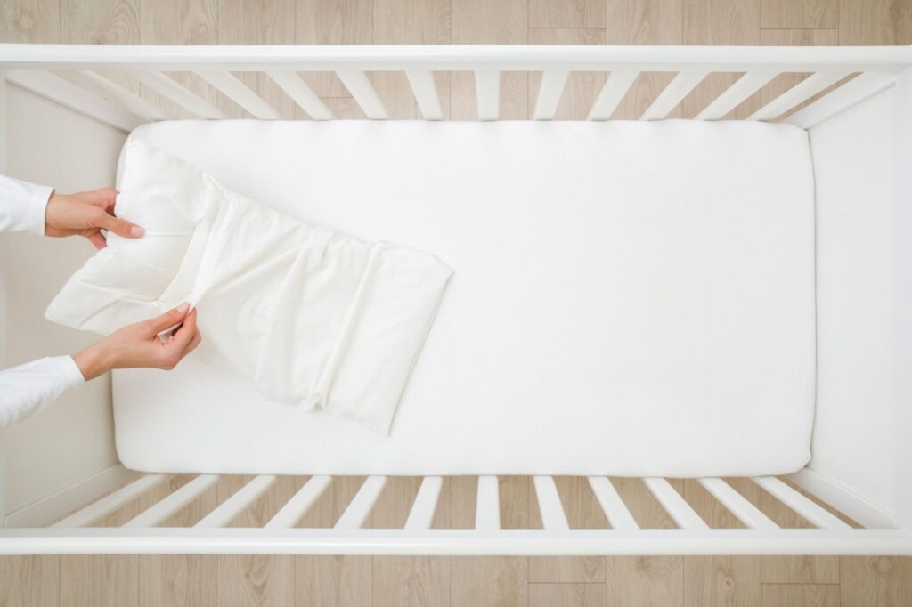 White pillowcase care essentials - cleaning products and fresh linens