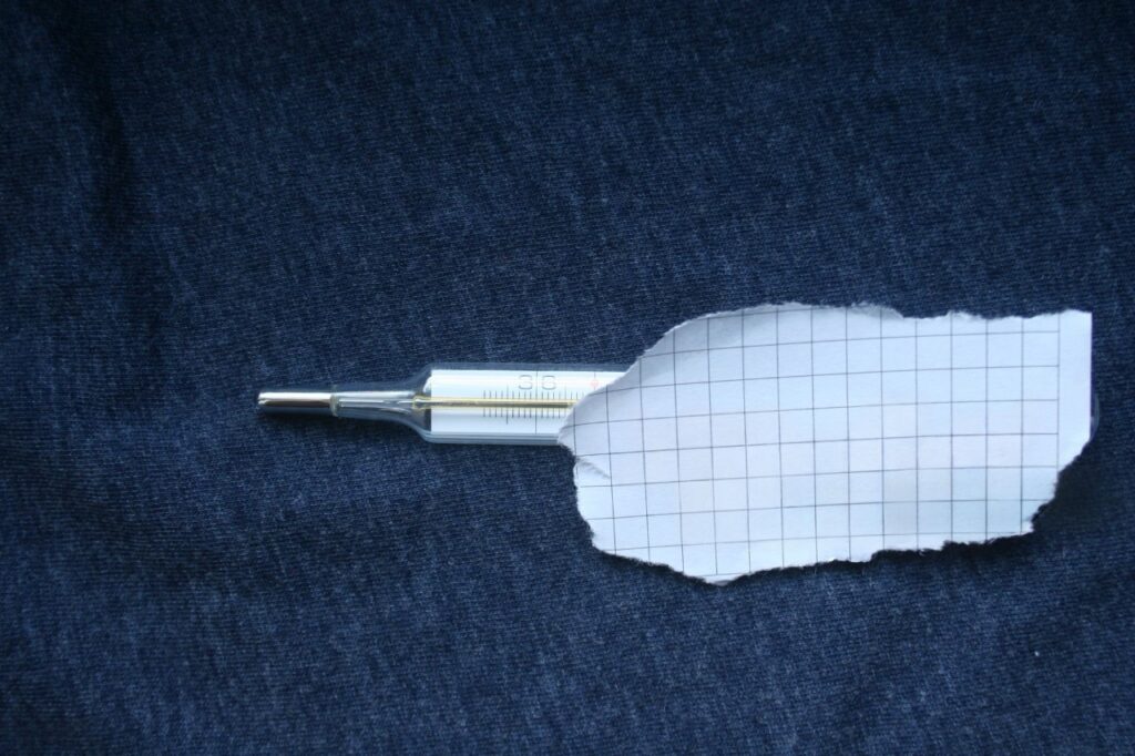 Humorous meme-style photo - thermometer at 90°F next to tangled sheets with text "When your bed becomes a sauna