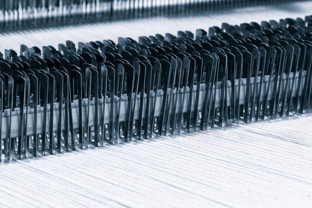 Quality at the source: The length and strength of the cotton fiber itself—like these long, silky staples—are far more important than any thread count number.