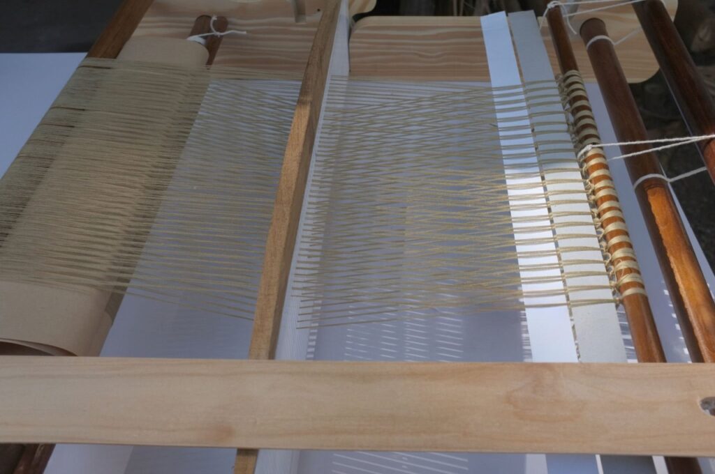 Image: A basic loom diagram showing the warp (lengthwise) and weft (side-to-side) threads, the foundation of all weaving.