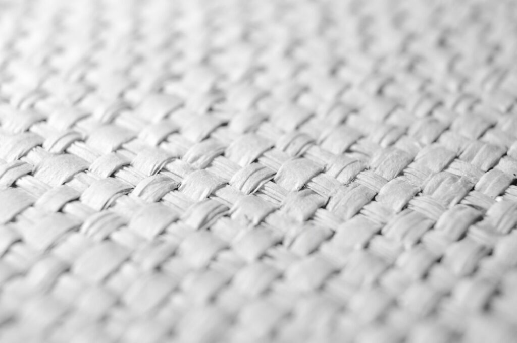 Image: A close-up view of the percale weave's tight, one-over-one-under structure, which creates its characteristic crisp and breathable feel.